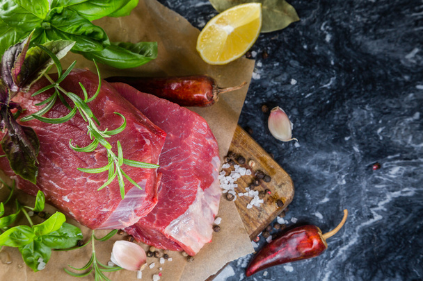 Raw beef meat with herbs and spices - 写真・画像