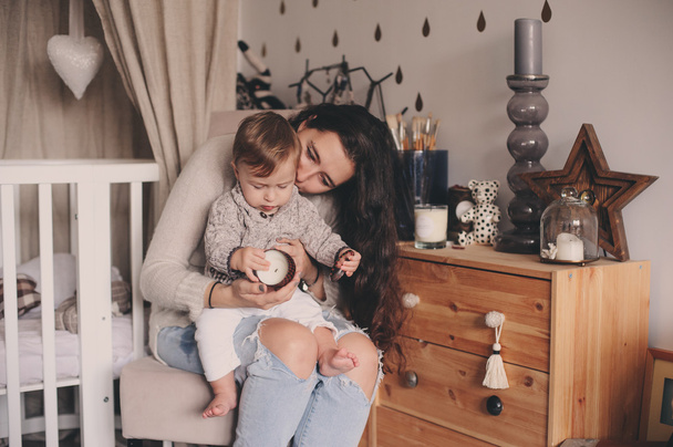 happy mother and baby son playing together at home. Happy family lifestyle concept in real life interior - Foto, immagini