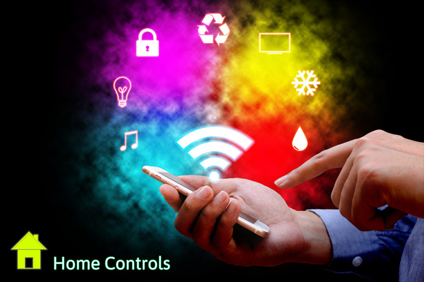 Man using smart phone or remote home control online home automat - Foto, afbeelding