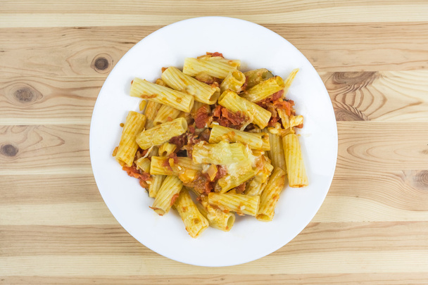 Pasta with cheese and sauce in plate - Foto, afbeelding