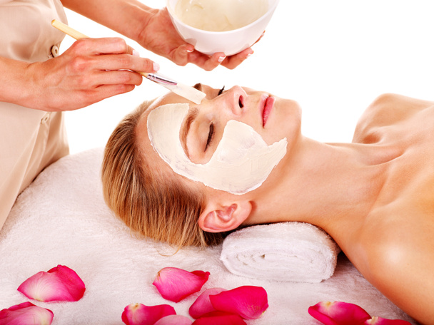 Clay facial mask in beauty spa. - Photo, Image