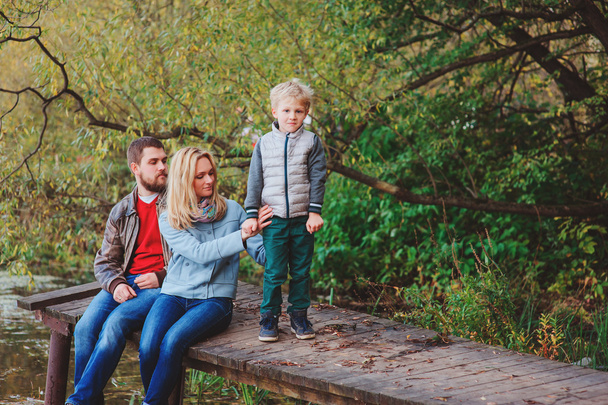 happy family spending time together outdoor. Lifestyle capture, rural cozy scene. - Фото, изображение