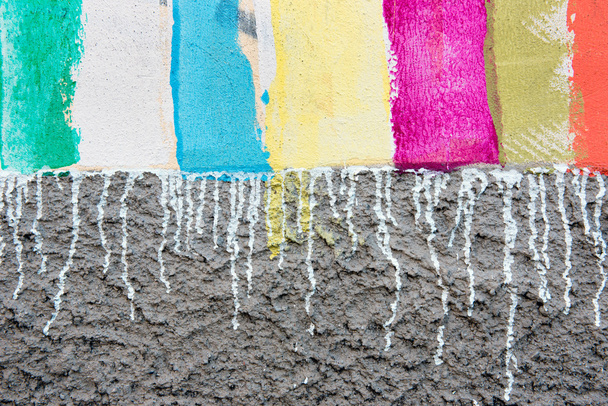 Colorful striped painting on rough concrete - 写真・画像