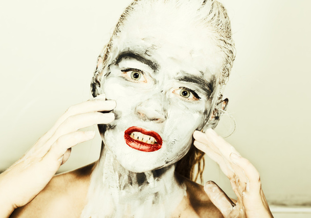 abstract art makeup. Face and neck girls smeared with gray colors and bright red lips. Holi Festival - Fotoğraf, Görsel