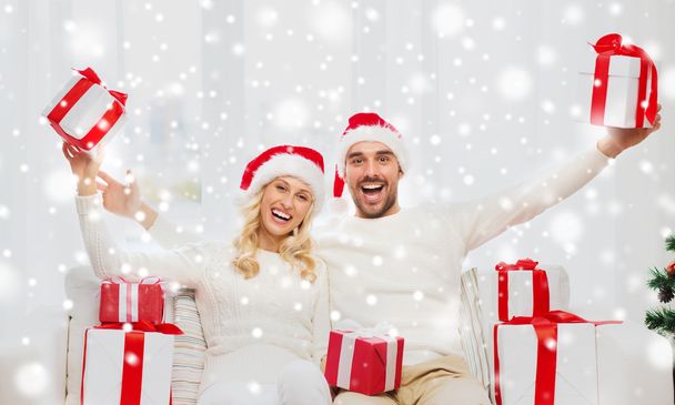 happy couple at home with christmas gift boxes - Photo, Image