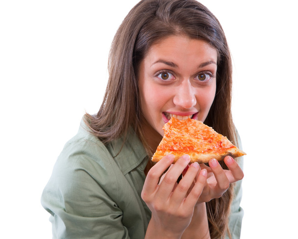 Teenage girl eating pizza - 写真・画像