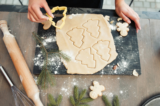 Close-up of gingerbread dough with formed cookies - Фото, изображение