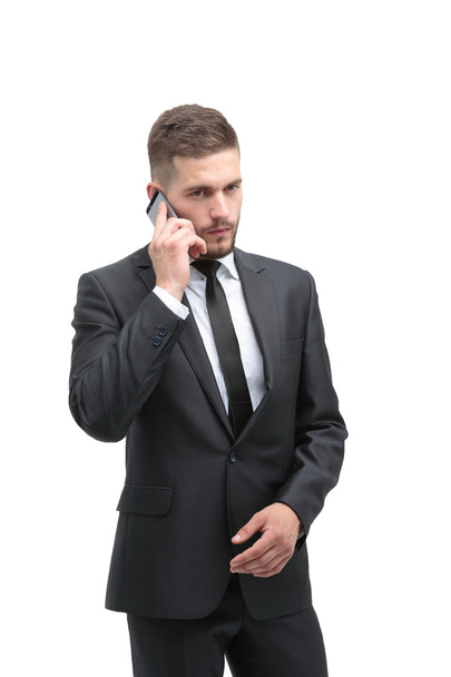 Красивий бізнесмен у костюмі, використовуючи телефон в офісі
 - Фото, зображення
