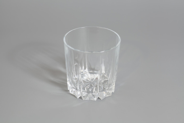 Empty glass on gray background - Foto, Imagem