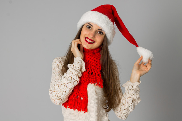 girl in santa hat and red scarf - Foto, Imagen