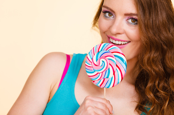 Woman joyful girl with lollipop candy - Foto, afbeelding