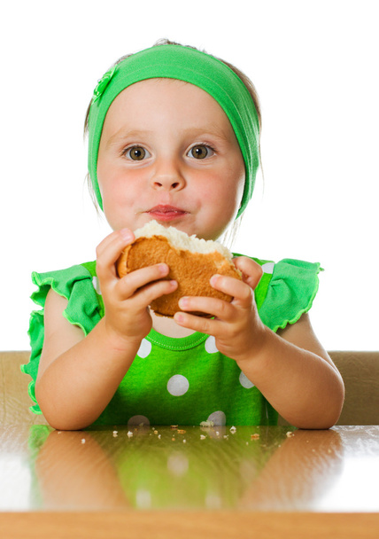 Pretty little girl eats bread - Φωτογραφία, εικόνα
