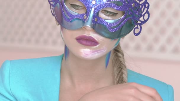 Green eyes gazing of the mysterious girl in venetian mask with winter art makeup - Video