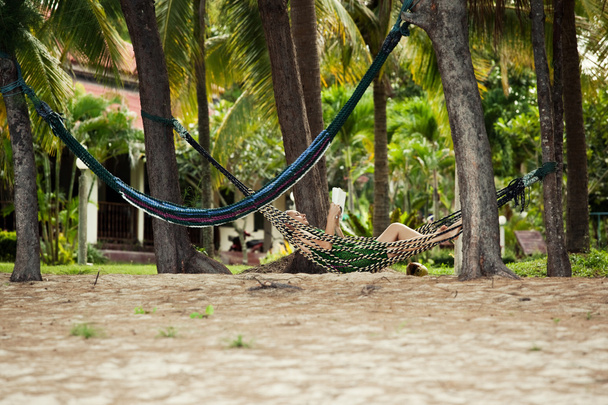 Girl resting in hammock - 写真・画像