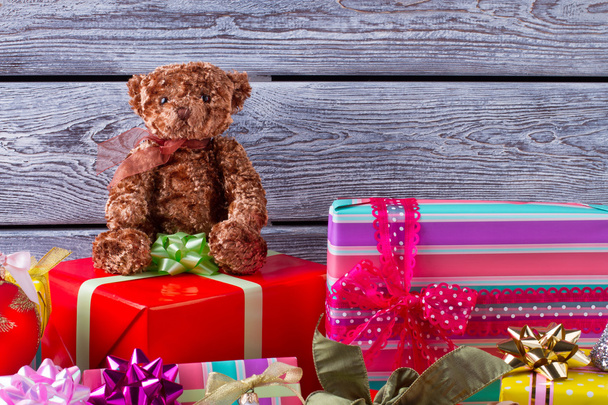 Christmas presents with colorful ribbon on dark wooden backgroun - Zdjęcie, obraz