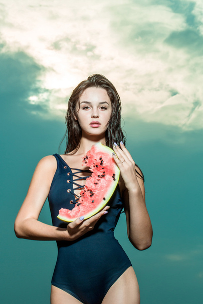 pretty girl on sky with watermelon - Photo, Image