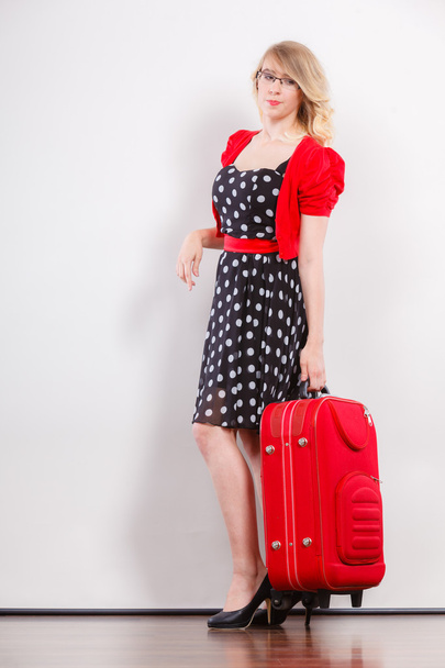 Elegant fashion woman with red suitcase - Foto, Imagen