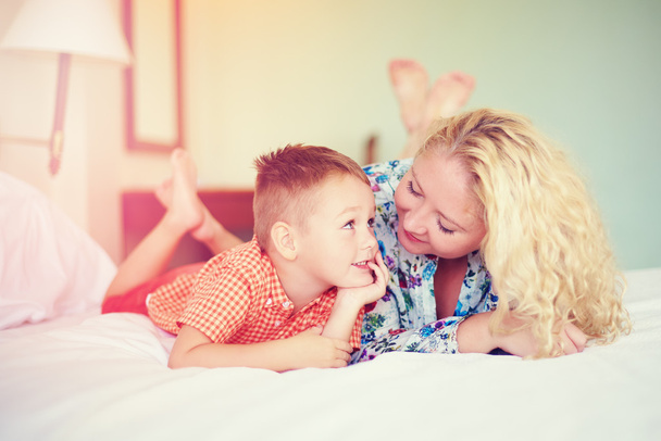 happy mother and son talking at home - Фото, изображение