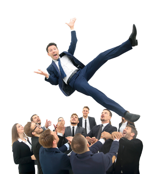 Business team throwing his colleague - 写真・画像