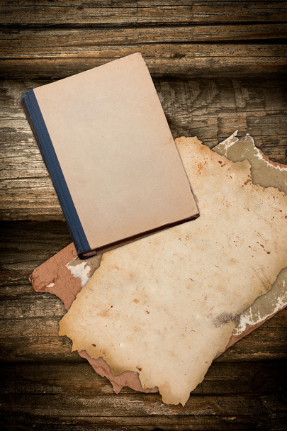 Aged book and papers on a wooden background - Fotografie, Obrázek
