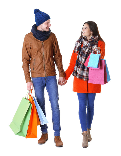 Happy couple with purchases isolated on white - Zdjęcie, obraz