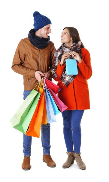 Happy couple with purchases isolated on white - Zdjęcie, obraz