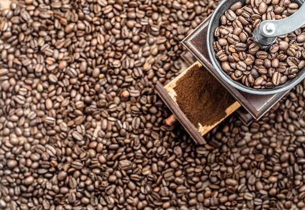 Coffee grinder and coffee beans background - Fotó, kép