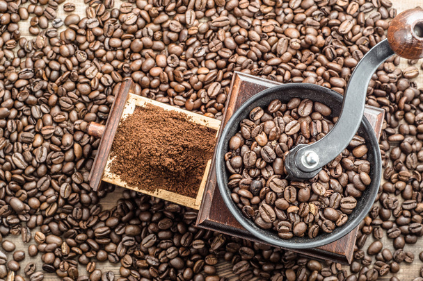 Coffee grinder and coffee beans background - Fotó, kép