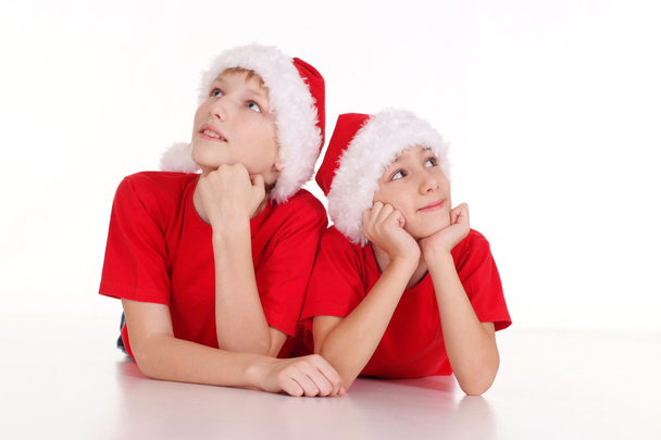 Kids in santa hats - Фото, изображение