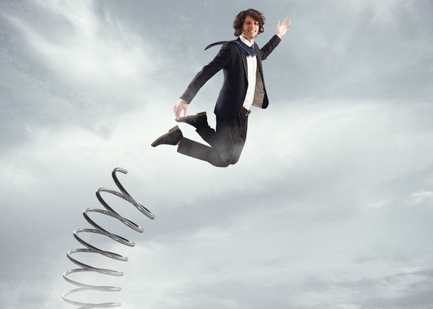 Liikemies hyppää korkealle
 - Valokuva, kuva