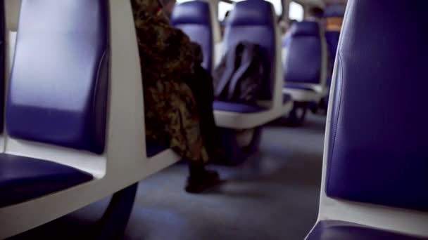 Teen girl typing message on phone sitting in electric train - Video, Çekim