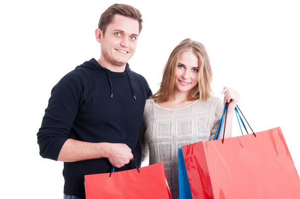 Attractive couple holding bunch of shopping bags - Fotografie, Obrázek
