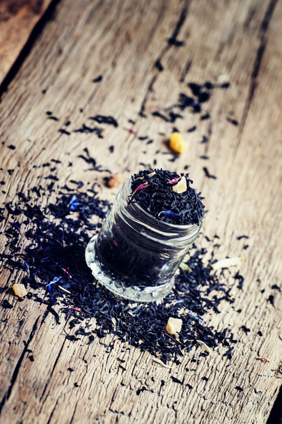 Dry Ceylon black tea with cornflower blue flowers and dried fruits - Photo, image