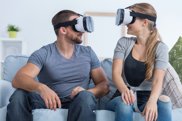 Man and woman wearing VR glasses - Foto, imagen