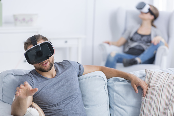Man and woman having fun using VR glasses - Zdjęcie, obraz