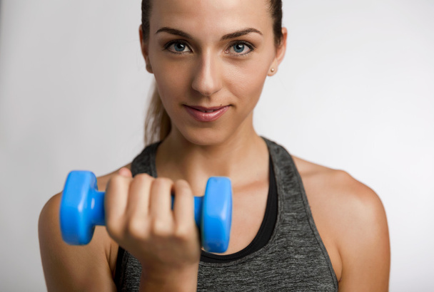 fitness woman with dumbbell in hand - Foto, Imagen