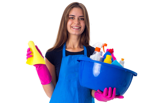 Woman holding cleaning things in washbowl - Valokuva, kuva