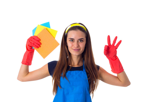 Woman in apron holding dusters - Photo, Image