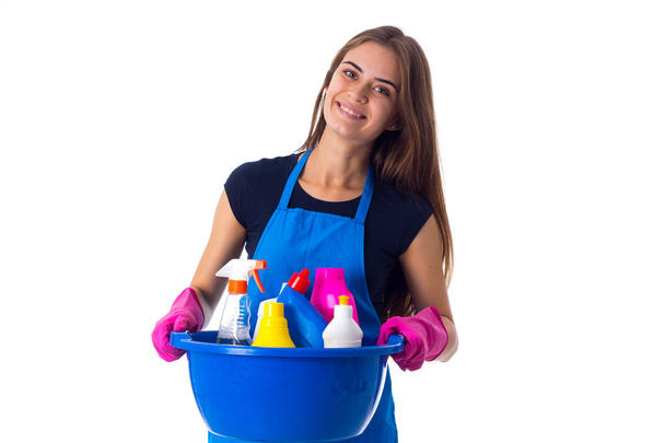 Woman holding cleaning things in washbowl - Foto, Bild