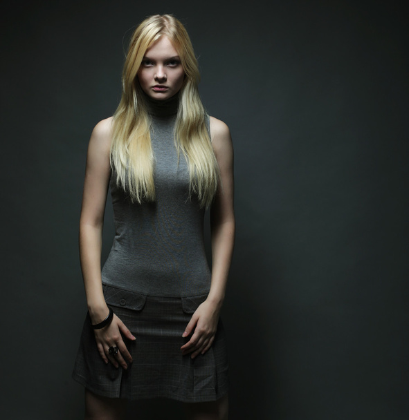 Portrait of beautiful young blonde girl in black dress. - Fotoğraf, Görsel