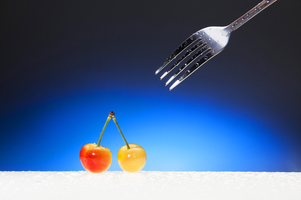 Cherries and fork - Фото, зображення