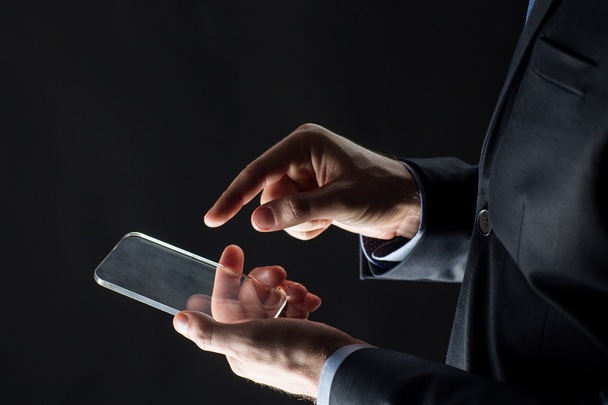 close up of businessman with glass smartphone - Photo, Image