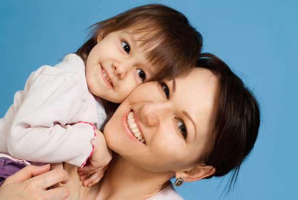 Beautiful Caucasian lady with a daughter - Photo, Image