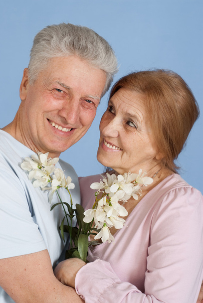 Happy Caucasian elderly stand together with the flower - Zdjęcie, obraz