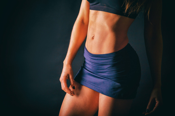  Chic, sexy belly girl on a dark background. Bright photos. - Photo, Image