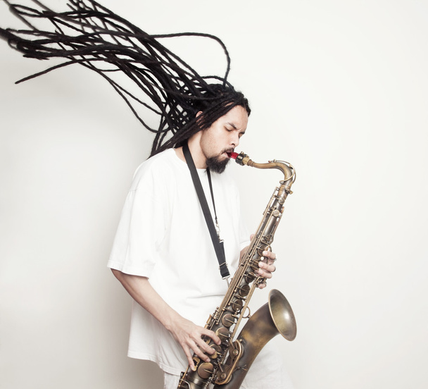 Male saxophonist with dreadlocks - Фото, изображение