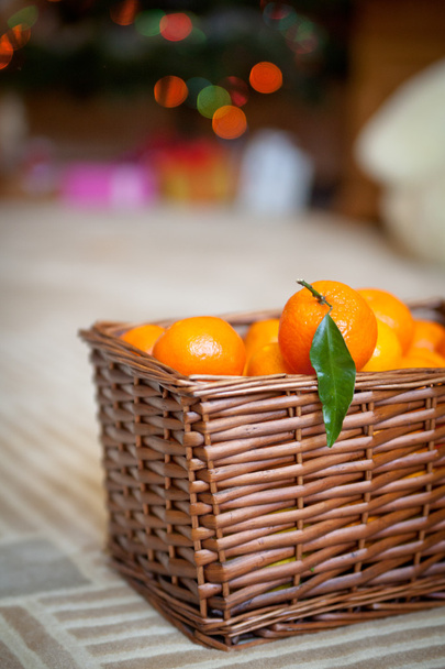 Basket with tangerines. Christmas decor - Fotoğraf, Görsel