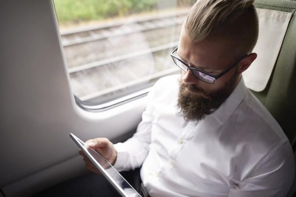 Young businessman in the train  - Photo, Image