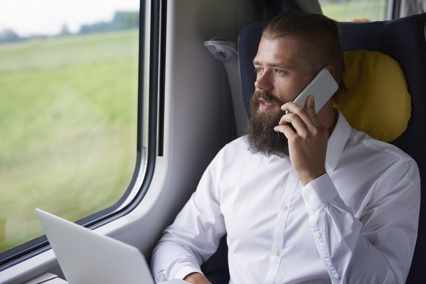 Young businessman in the train  - Φωτογραφία, εικόνα