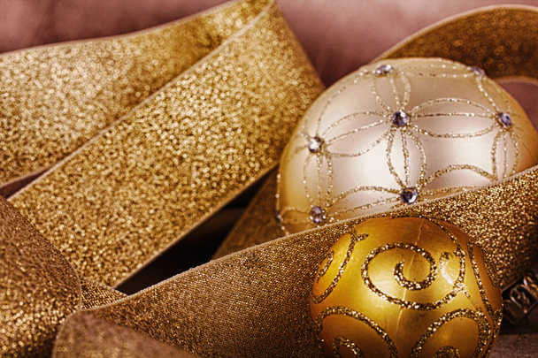 Festive gold Christmas decorations on fabric background HDR Filt - Photo, image